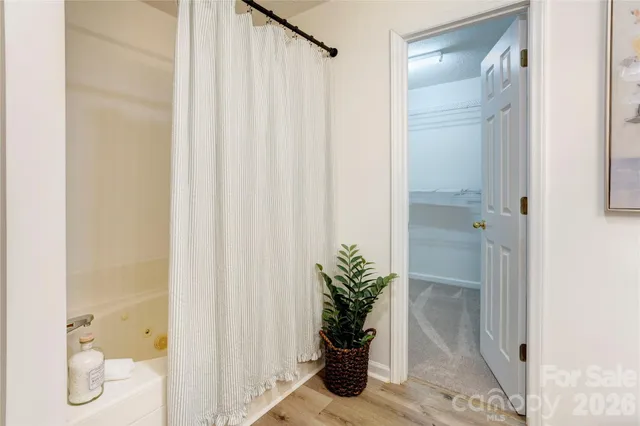 a bathroom with a glass shower door