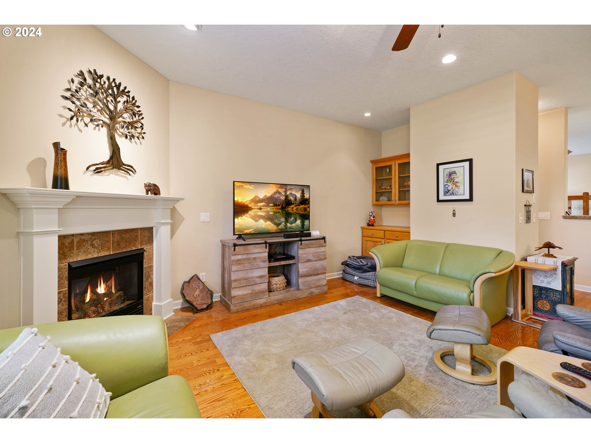 2155 Southeast Rhododendron Avenue Dallas, OR 97338 - Photo 13 of 40 a living room with furniture and a fireplace