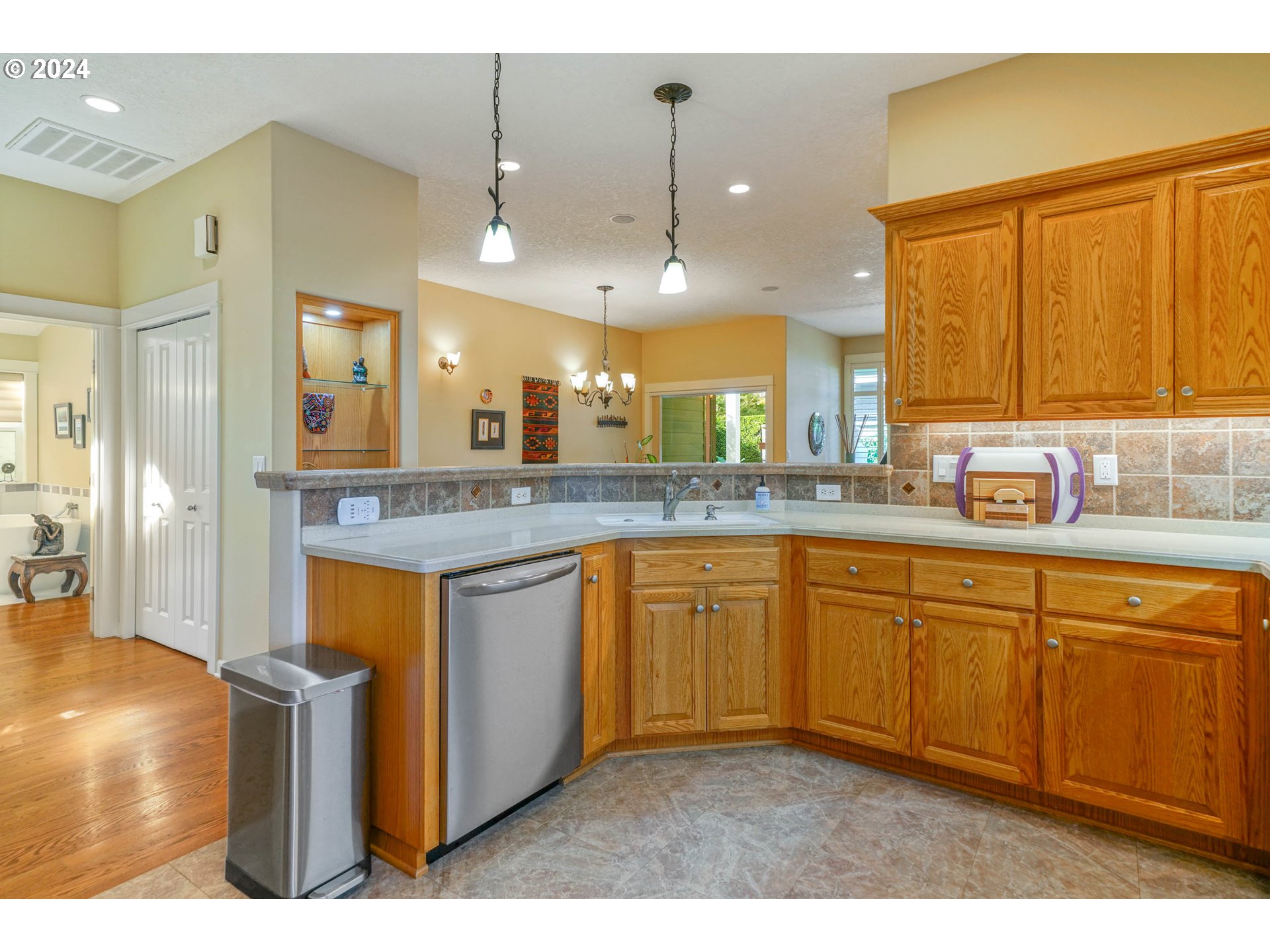 2155 Southeast Rhododendron Avenue Dallas, OR 97338 - Photo 20 of 40 a kitchen with stainless steel appliances granite countertop a sink and cabinets