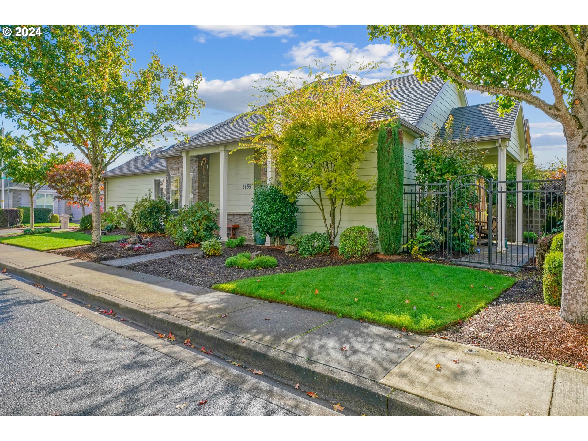 2155 Southeast Rhododendron Avenue Dallas, OR 97338 - Photo 2 of 40 a view of a house with a yard and large tree
