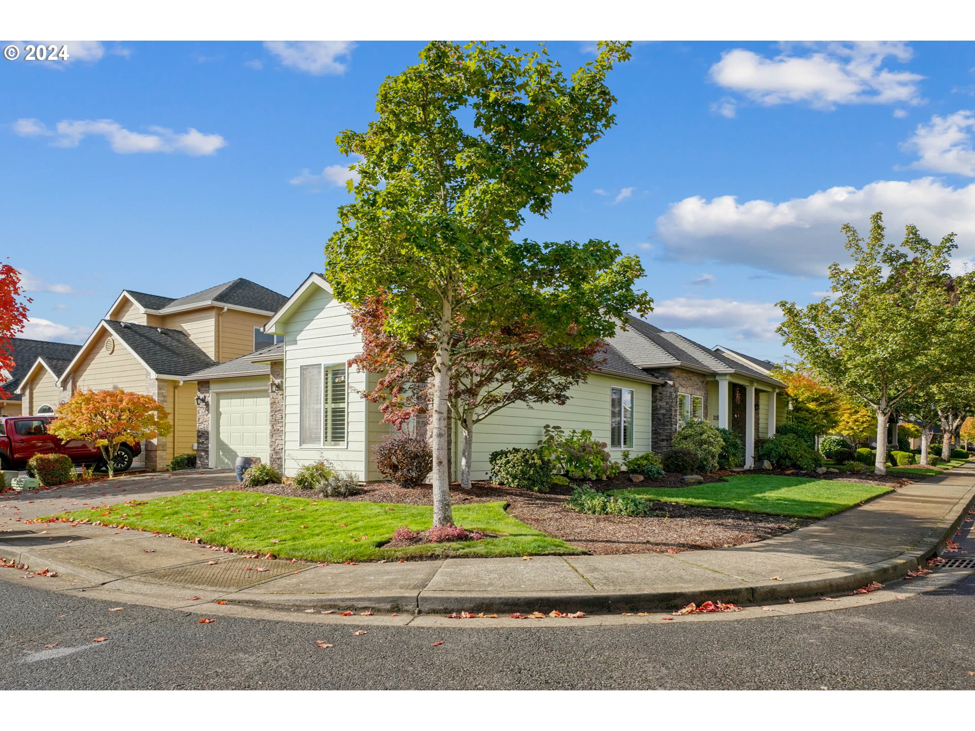 2155 Southeast Rhododendron Avenue Dallas, OR 97338 - Photo 3 of 40 a front view of a house with a yard