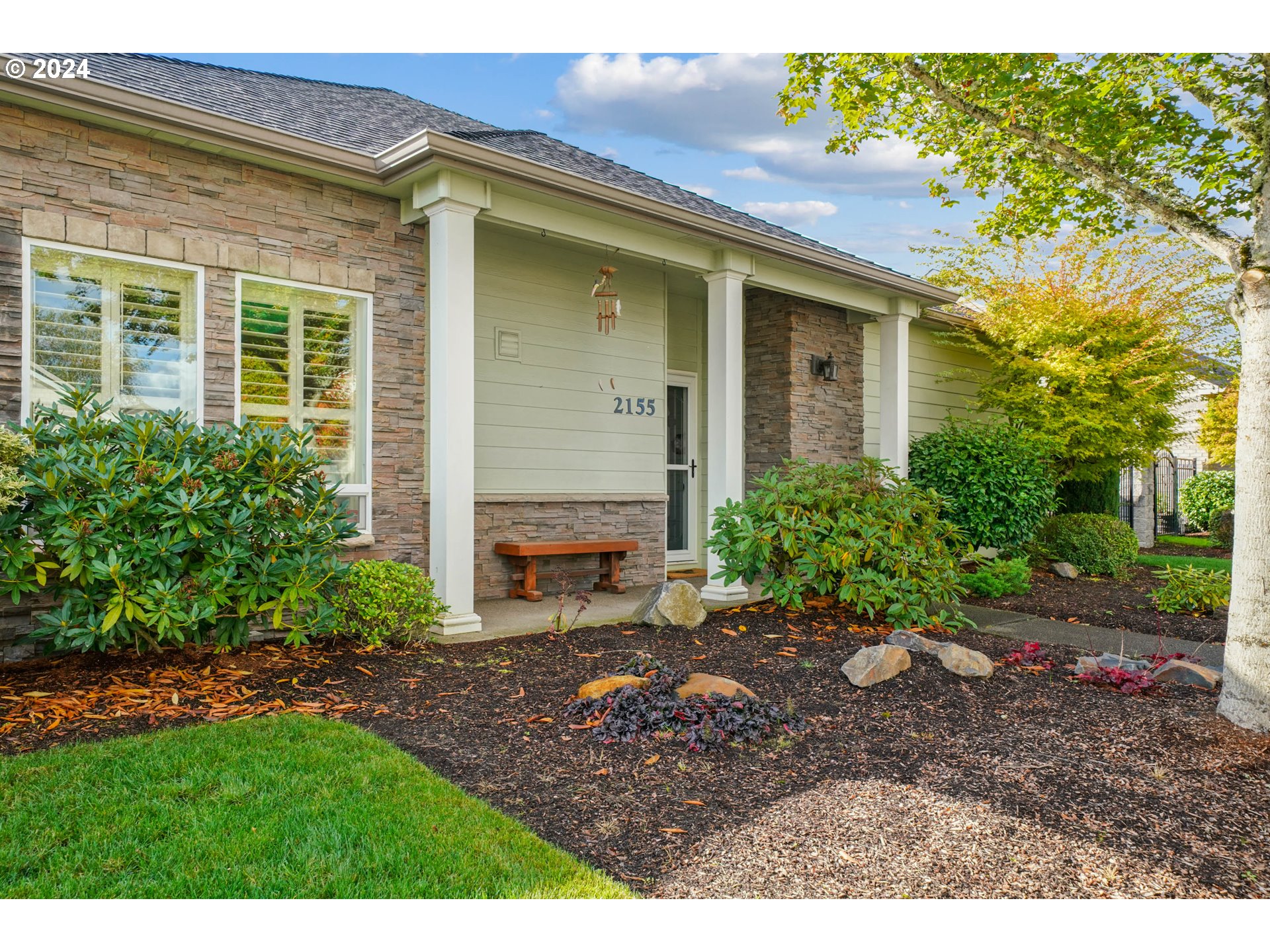 2155 Southeast Rhododendron Avenue Dallas, OR 97338 - Photo 5 of 40 a view of a backyard with plants and large tree