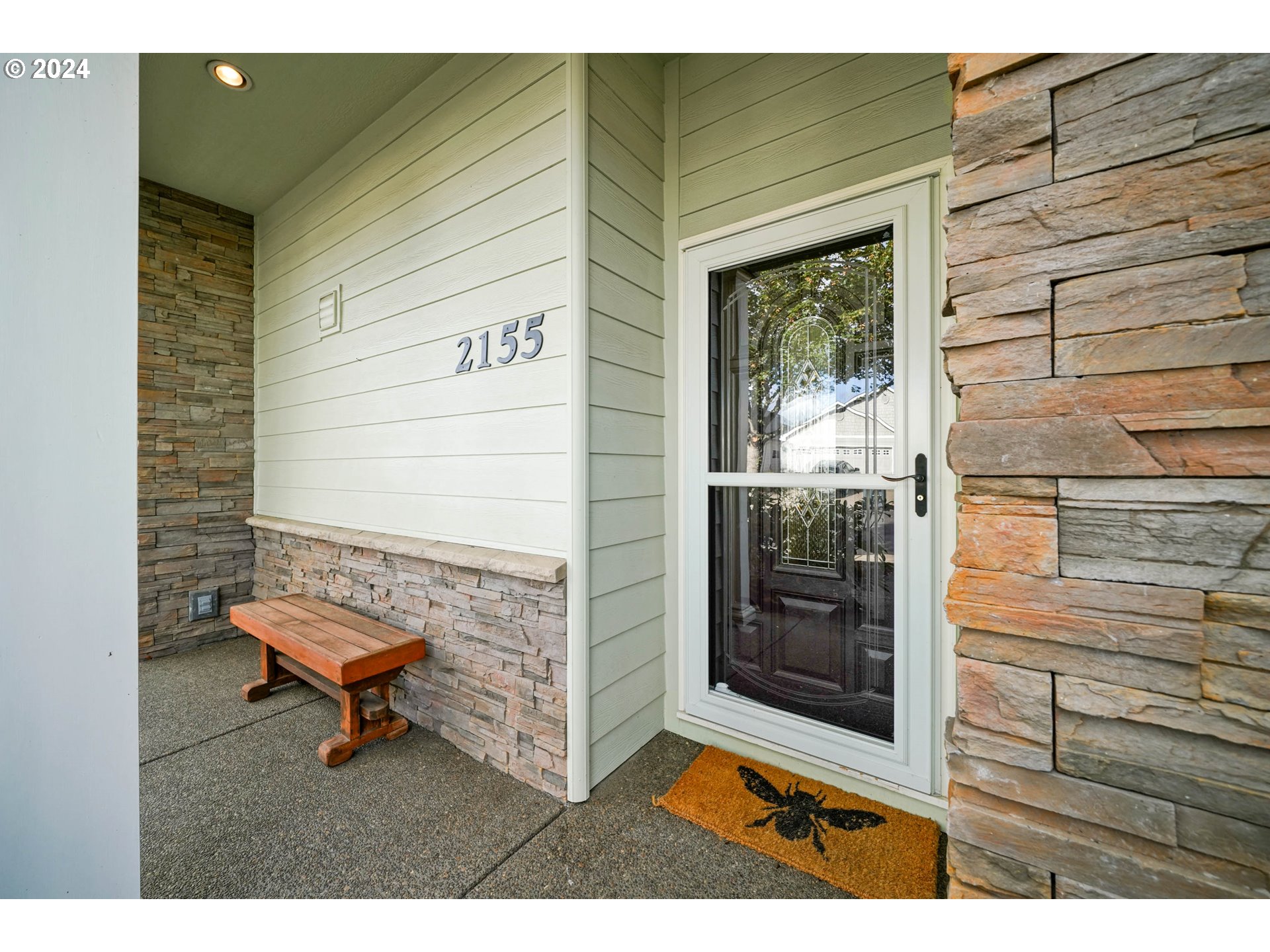 2155 Southeast Rhododendron Avenue Dallas, OR 97338 - Photo 6 of 40 a view of a porch with a bench