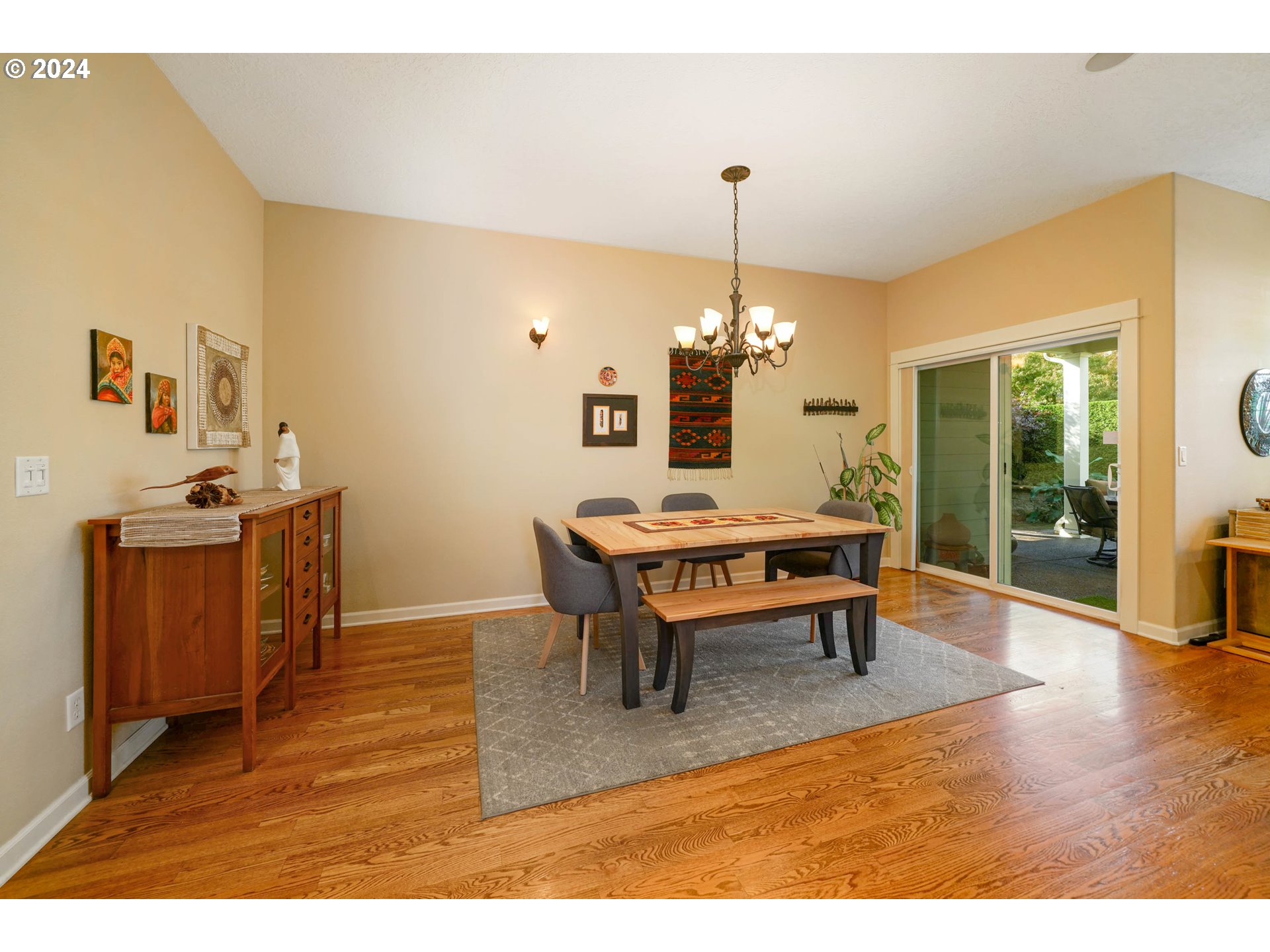 2155 Southeast Rhododendron Avenue Dallas, OR 97338 - Photo 8 of 40 a living room with dining table and wooden floor