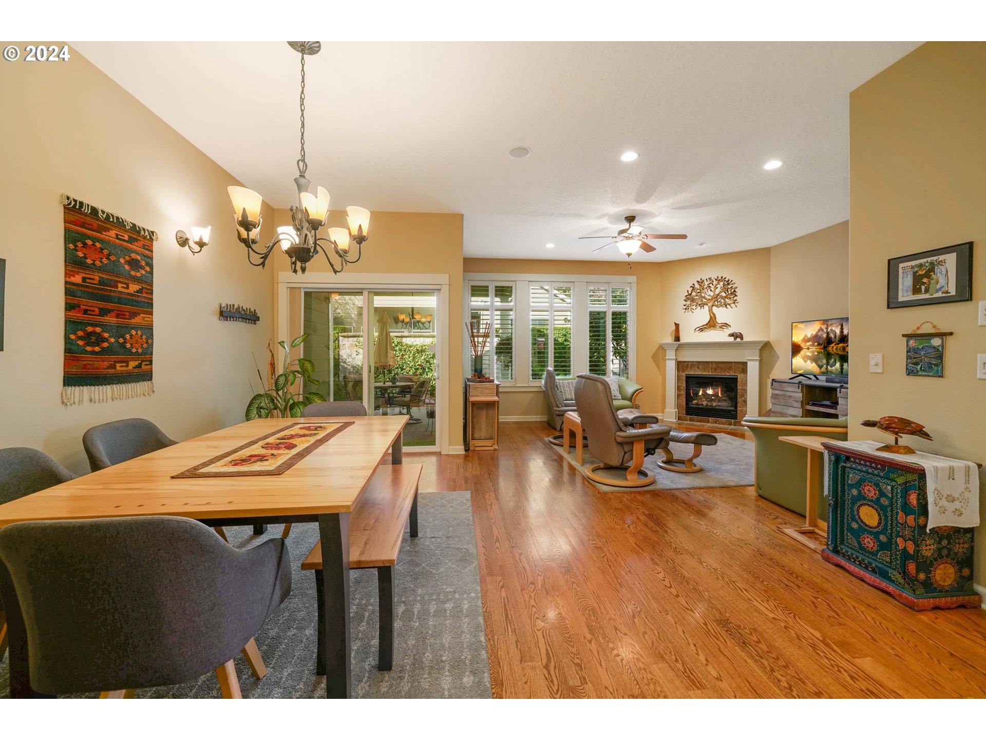 2155 Southeast Rhododendron Avenue Dallas, OR 97338 - Photo 10 of 40 a view of a dining room with furniture a chandelier and wooden floor
