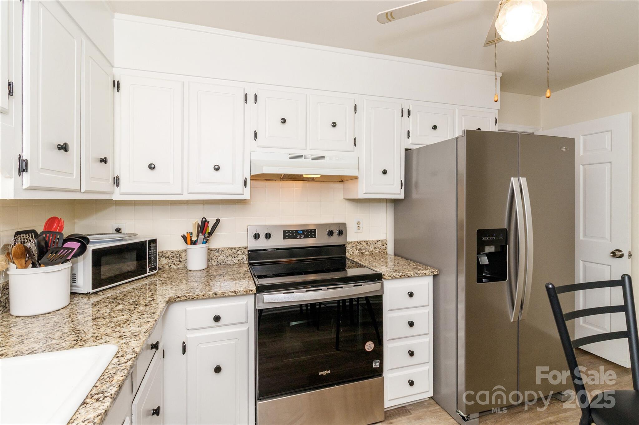 8300 Knights Bridge Road Charlotte, NC 28210 - Photo 17 of 47 a kitchen with stainless steel appliances granite countertop a refrigerator sink and stove