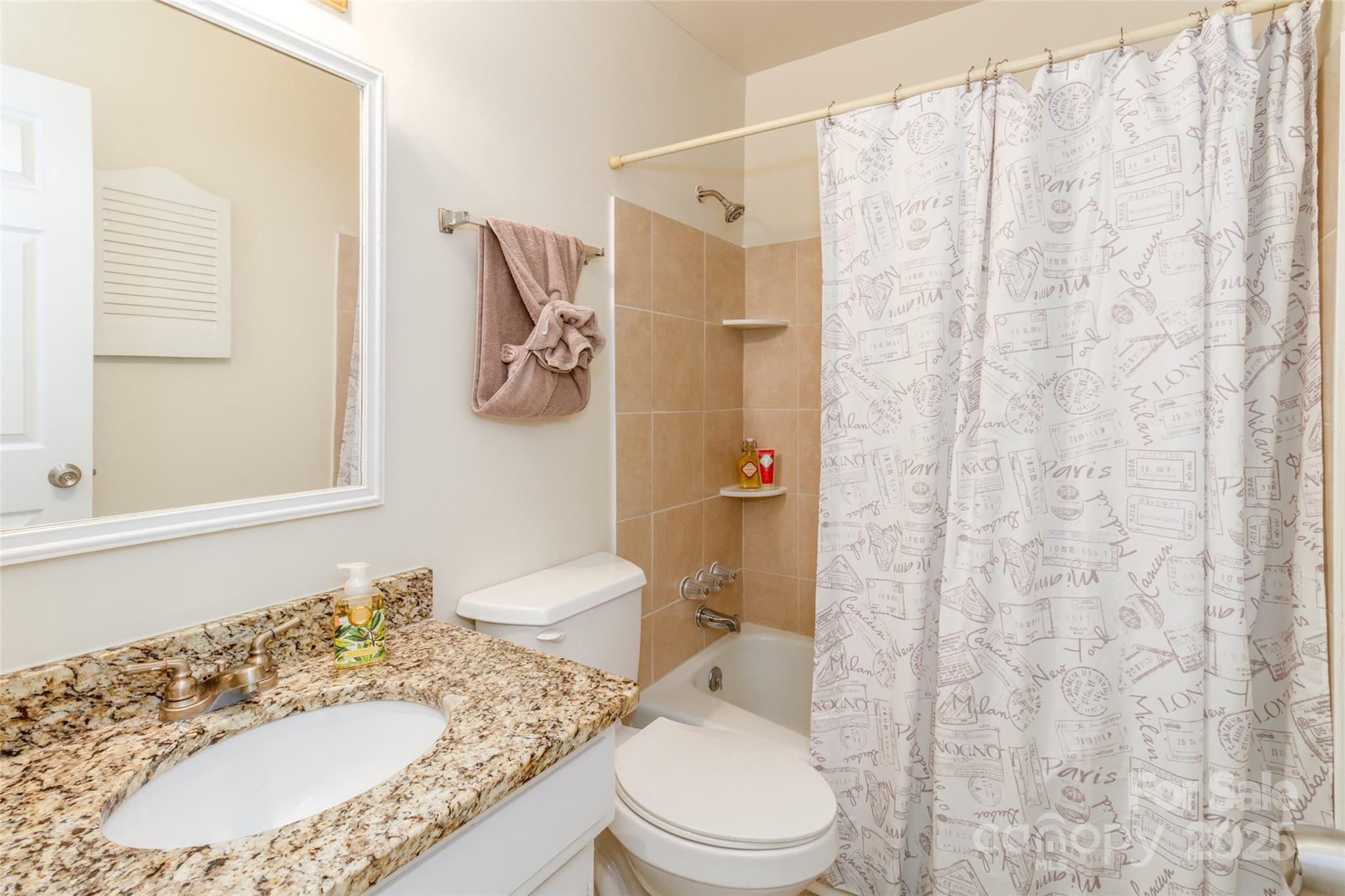 8300 Knights Bridge Road Charlotte, NC 28210 - Photo 21 of 47 a bathroom with a granite countertop sink toilet and shower