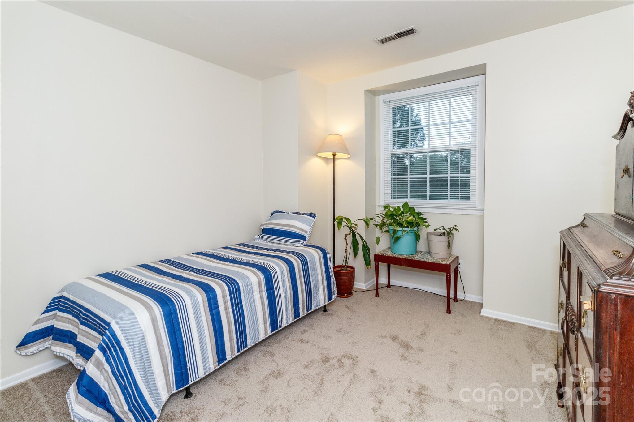 8300 Knights Bridge Road Charlotte, NC 28210 - Photo 22 of 47 a bedroom with a bed and a window