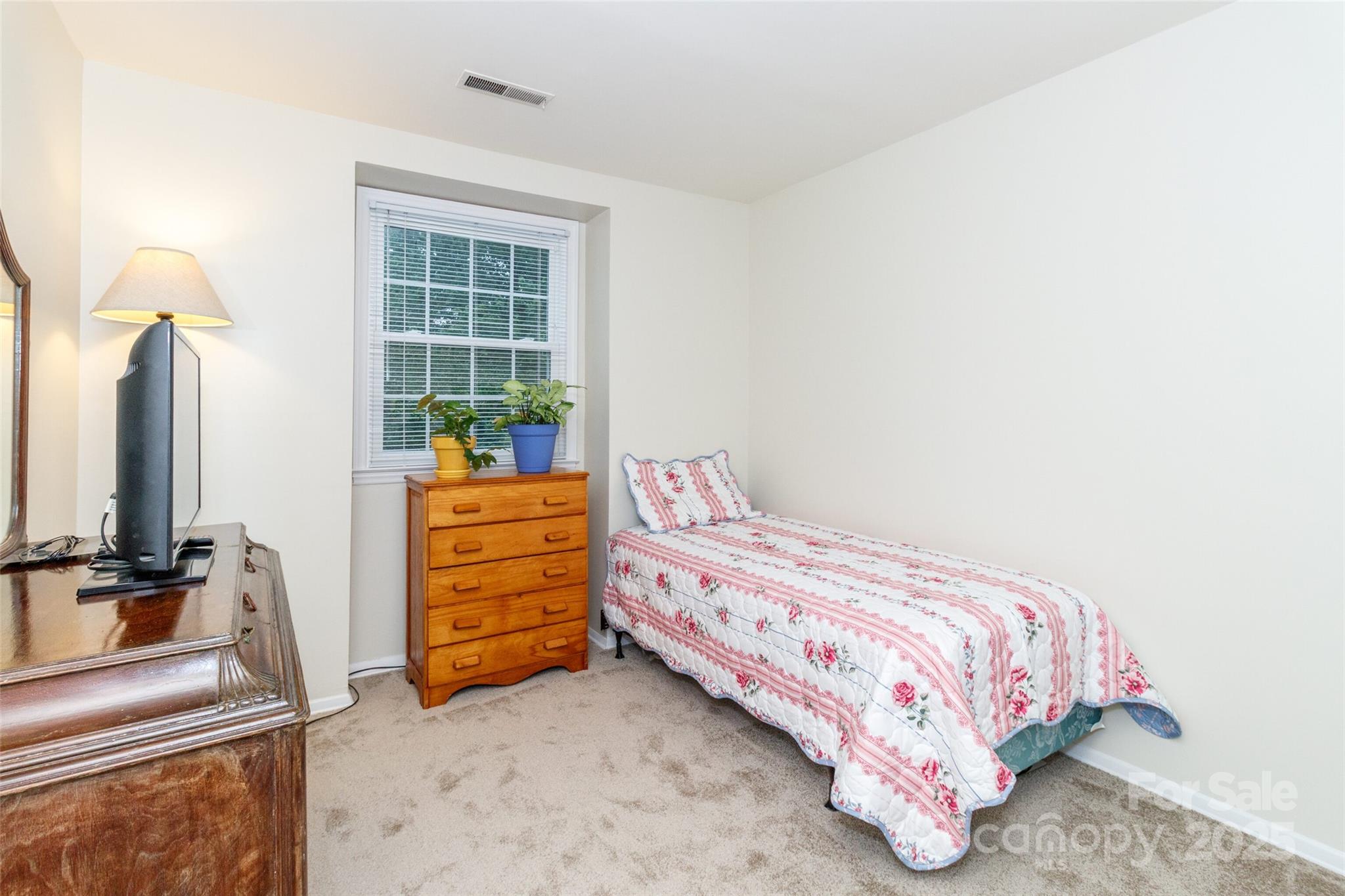 8300 Knights Bridge Road Charlotte, NC 28210 - Photo 25 of 47 a bedroom with a bed and a sink