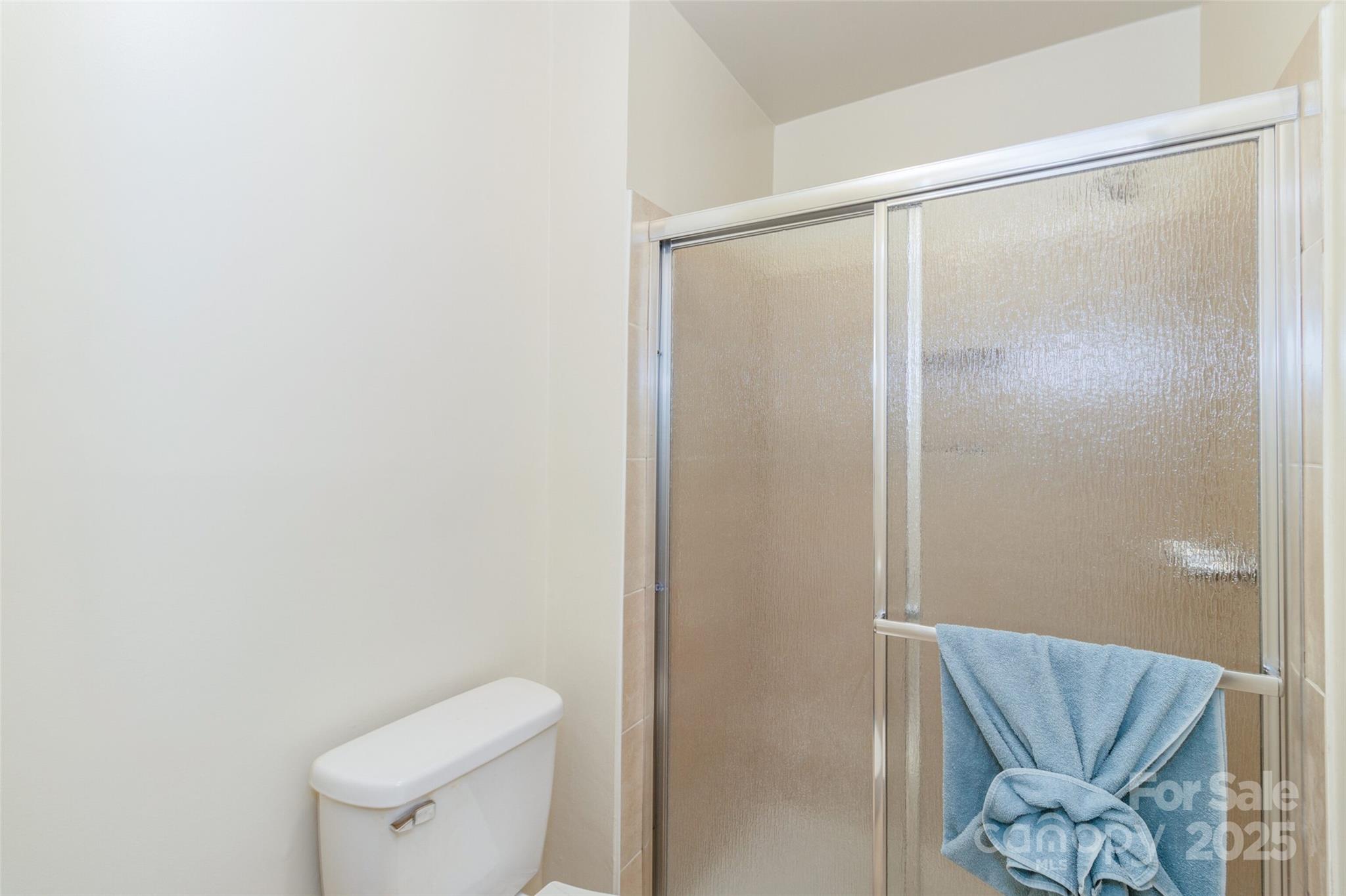 8300 Knights Bridge Road Charlotte, NC 28210 - Photo 32 of 47 a bathroom with a shower and a toilet