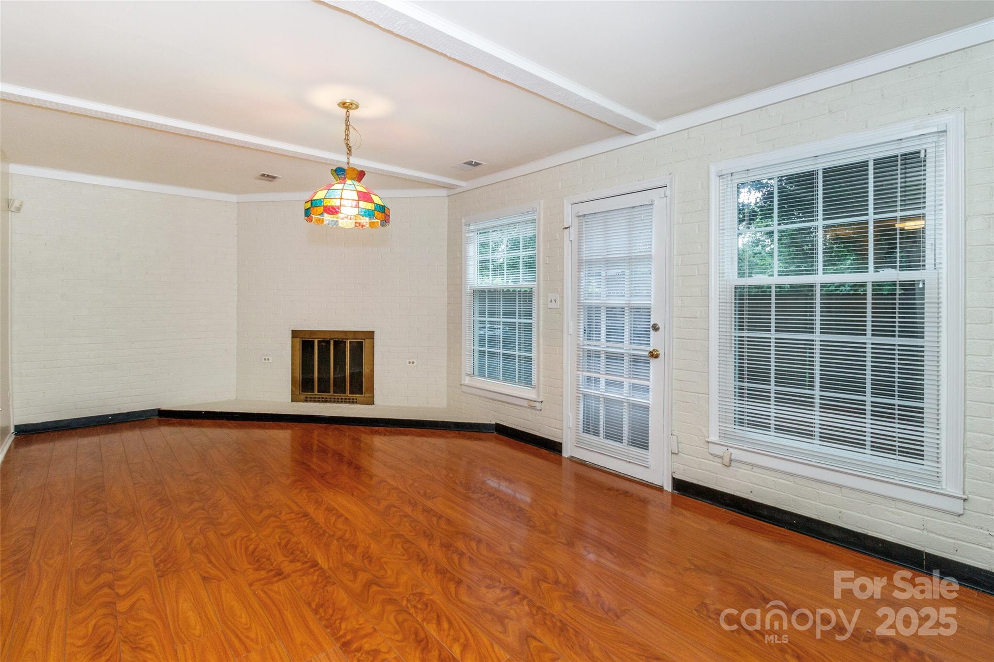 8300 Knights Bridge Road Charlotte, NC 28210 - Photo 35 of 47 a view of an empty room with a window and chandelier