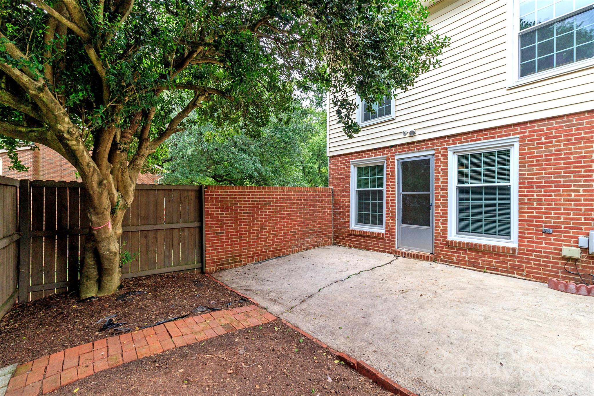 8300 Knights Bridge Road Charlotte, NC 28210 - Photo 39 of 47 a view of backyard with a barn and a large cactus tree