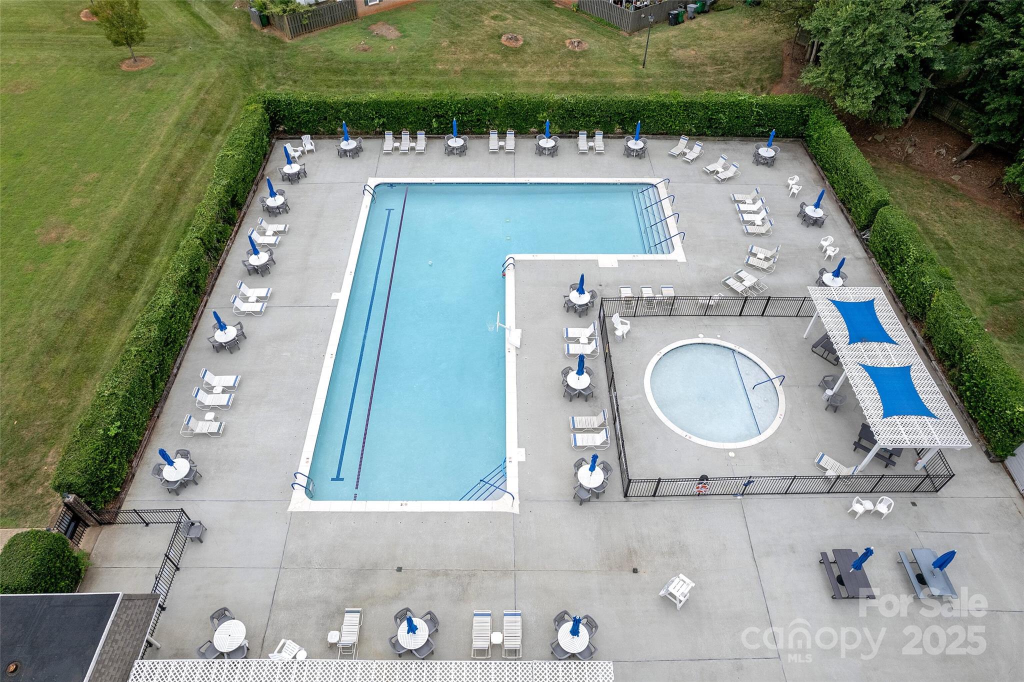 8300 Knights Bridge Road Charlotte, NC 28210 - Photo 42 of 47 an aerial view of a house with outdoor space pool seating area and yard