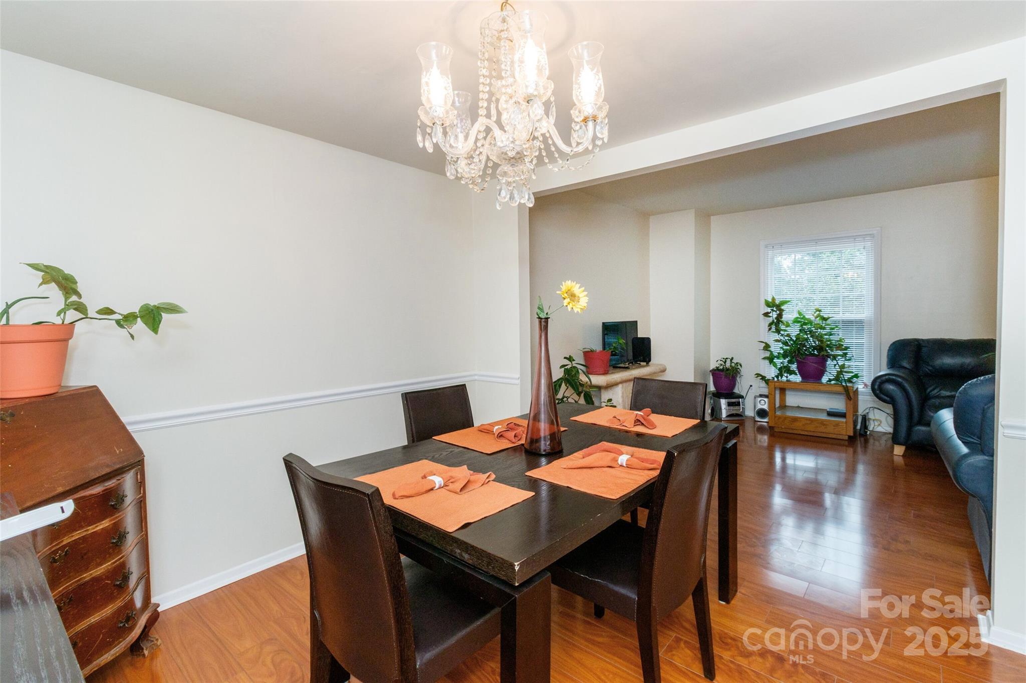 8300 Knights Bridge Road Charlotte, NC 28210 - Photo 7 of 47 a view of a dining room with furniture and wooden floor
