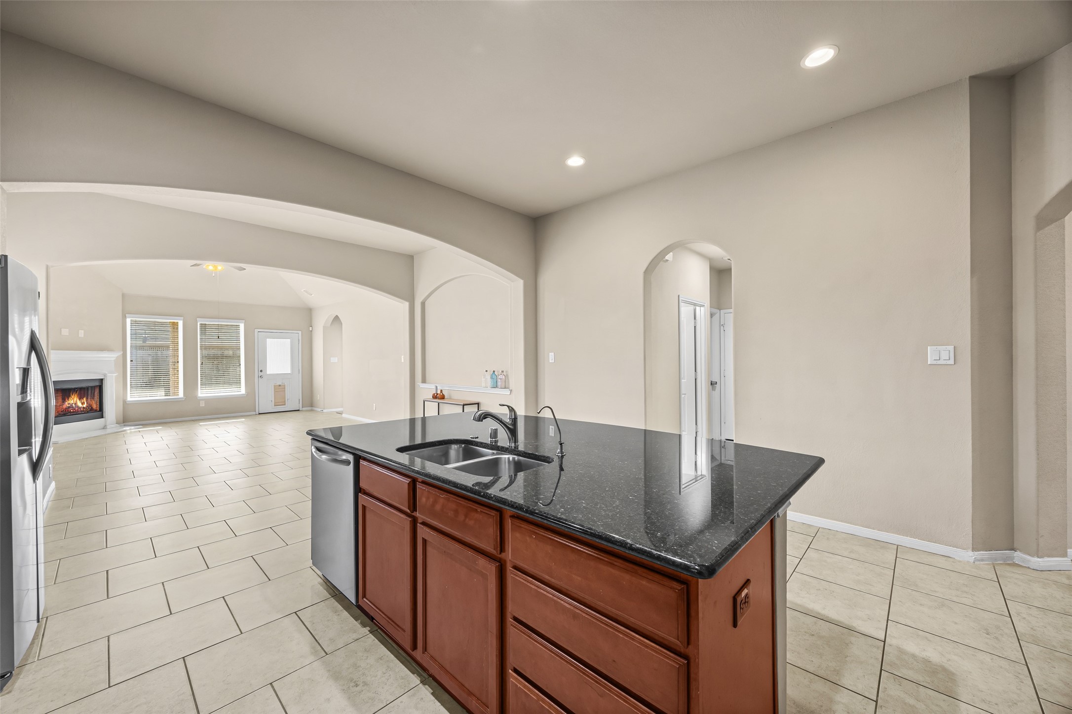5615 Glenfield Spring Lane Spring, TX 77389 - Photo 12 of 28 a kitchen with stainless steel appliances granite countertop a sink and a stove