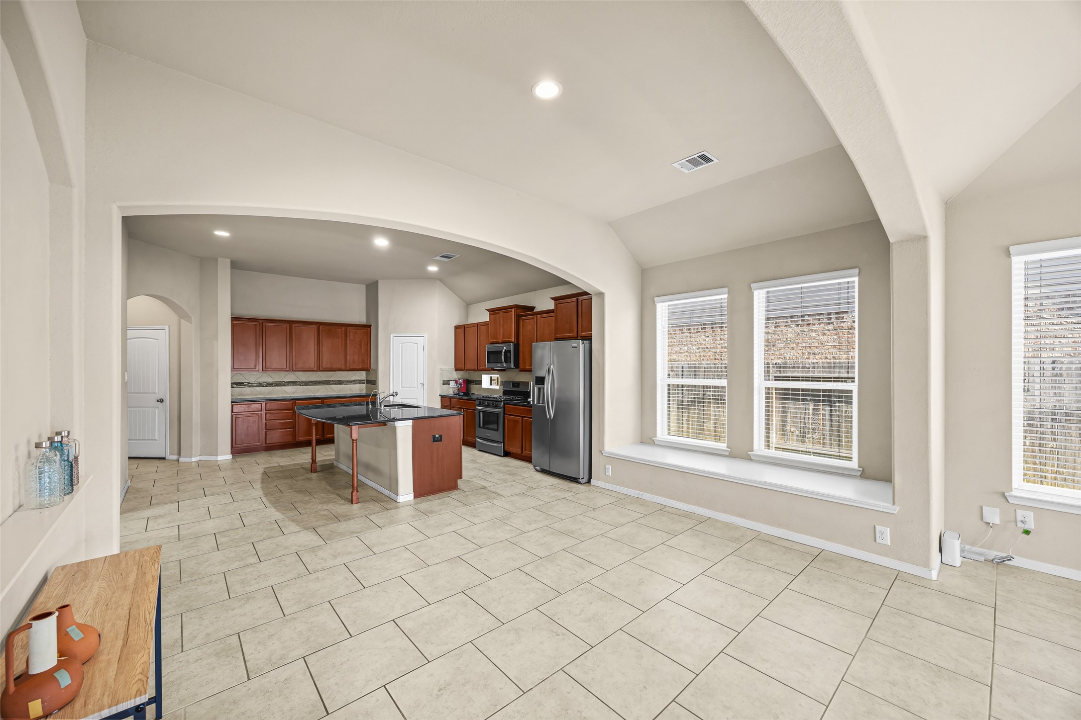 5615 Glenfield Spring Lane Spring, TX 77389 - Photo 14 of 28 a kitchen with stainless steel appliances a refrigerator and a sink