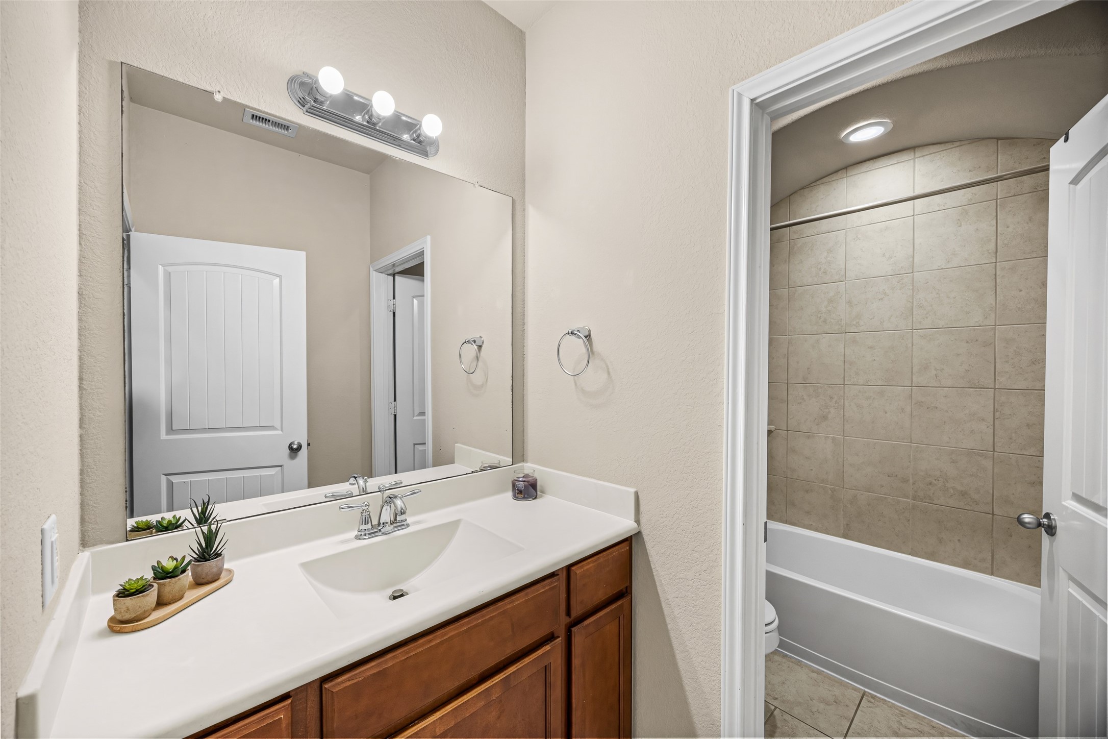 5615 Glenfield Spring Lane Spring, TX 77389 - Photo 18 of 28 a bathroom with a sink double vanity granite tub and shower