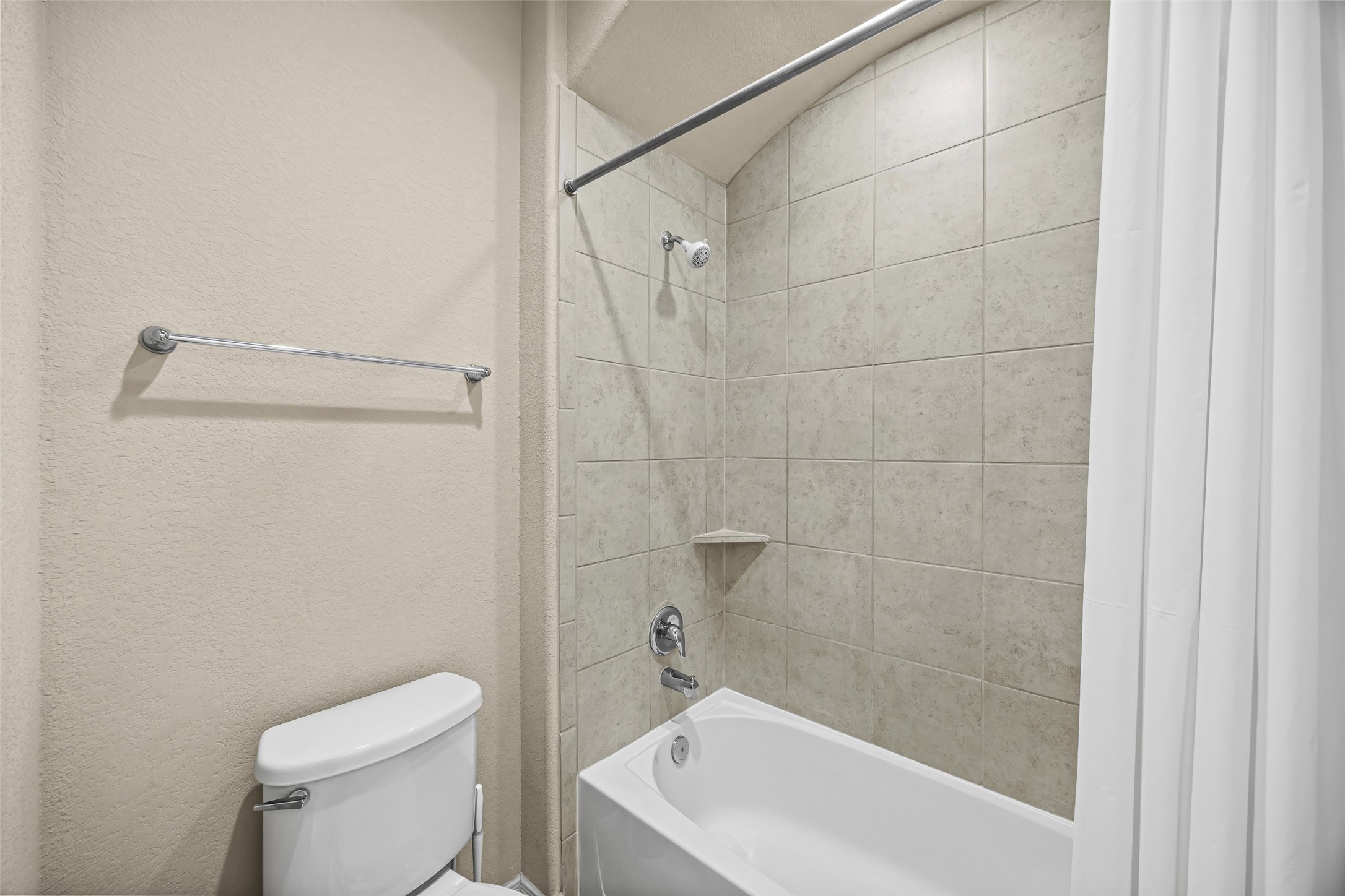 5615 Glenfield Spring Lane Spring, TX 77389 - Photo 19 of 28 a white bath tub sitting next to a toilet