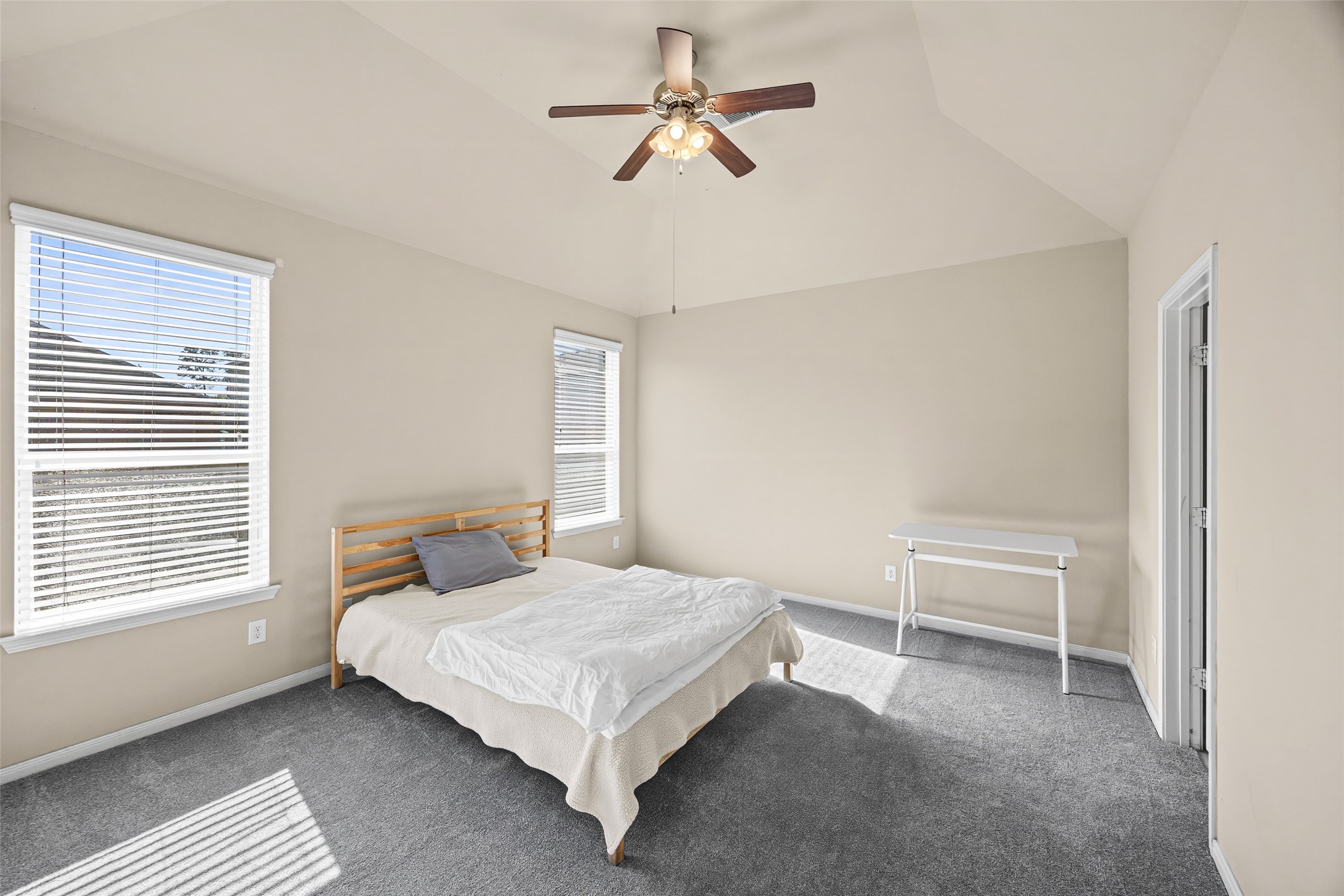 5615 Glenfield Spring Lane Spring, TX 77389 - Photo 21 of 28 a bedroom with a bed and a ceiling fan