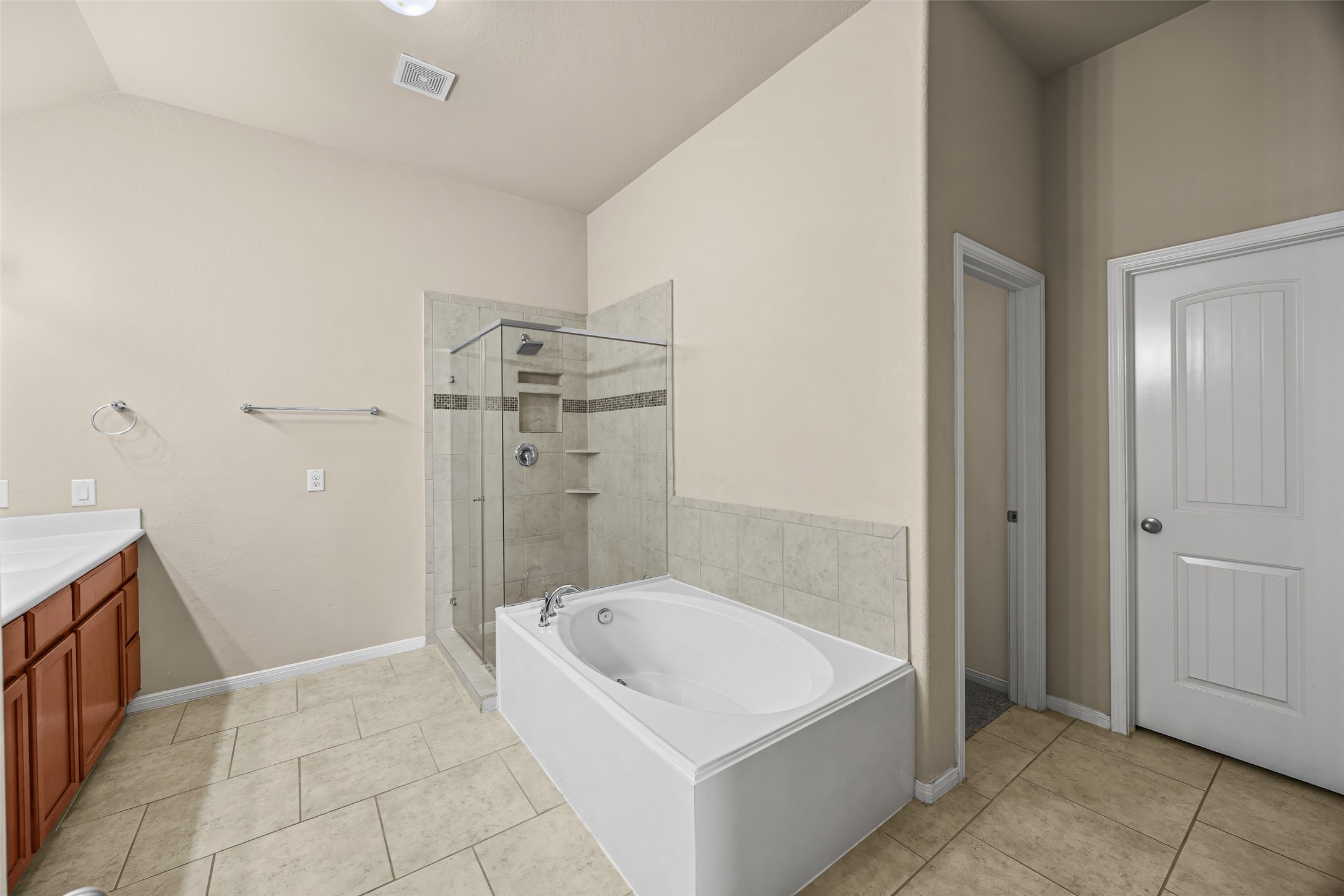 5615 Glenfield Spring Lane Spring, TX 77389 - Photo 23 of 28 a bathroom with a bathtub and shower