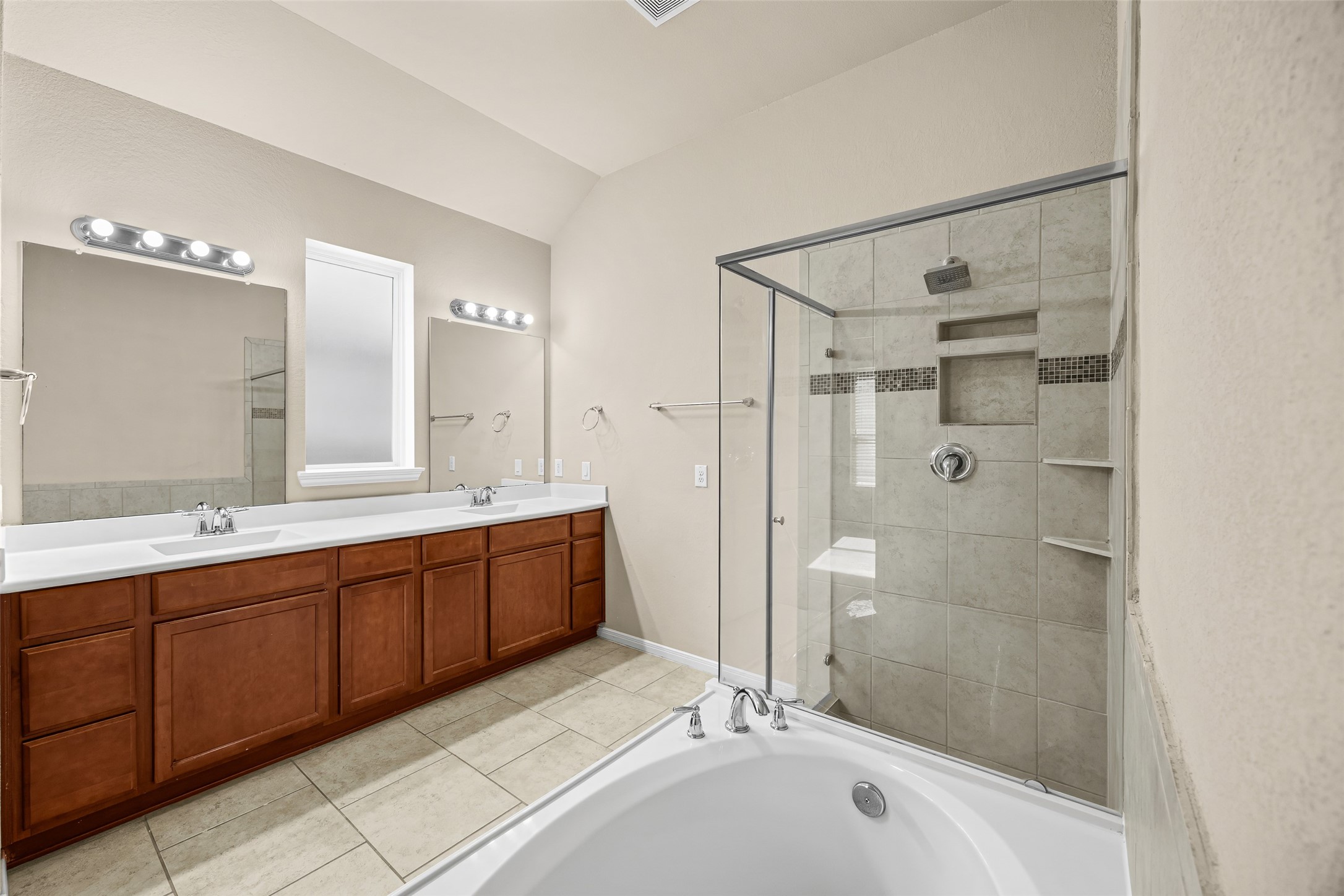 5615 Glenfield Spring Lane Spring, TX 77389 - Photo 24 of 28 a spacious bathroom with a tub sink shower and mirror