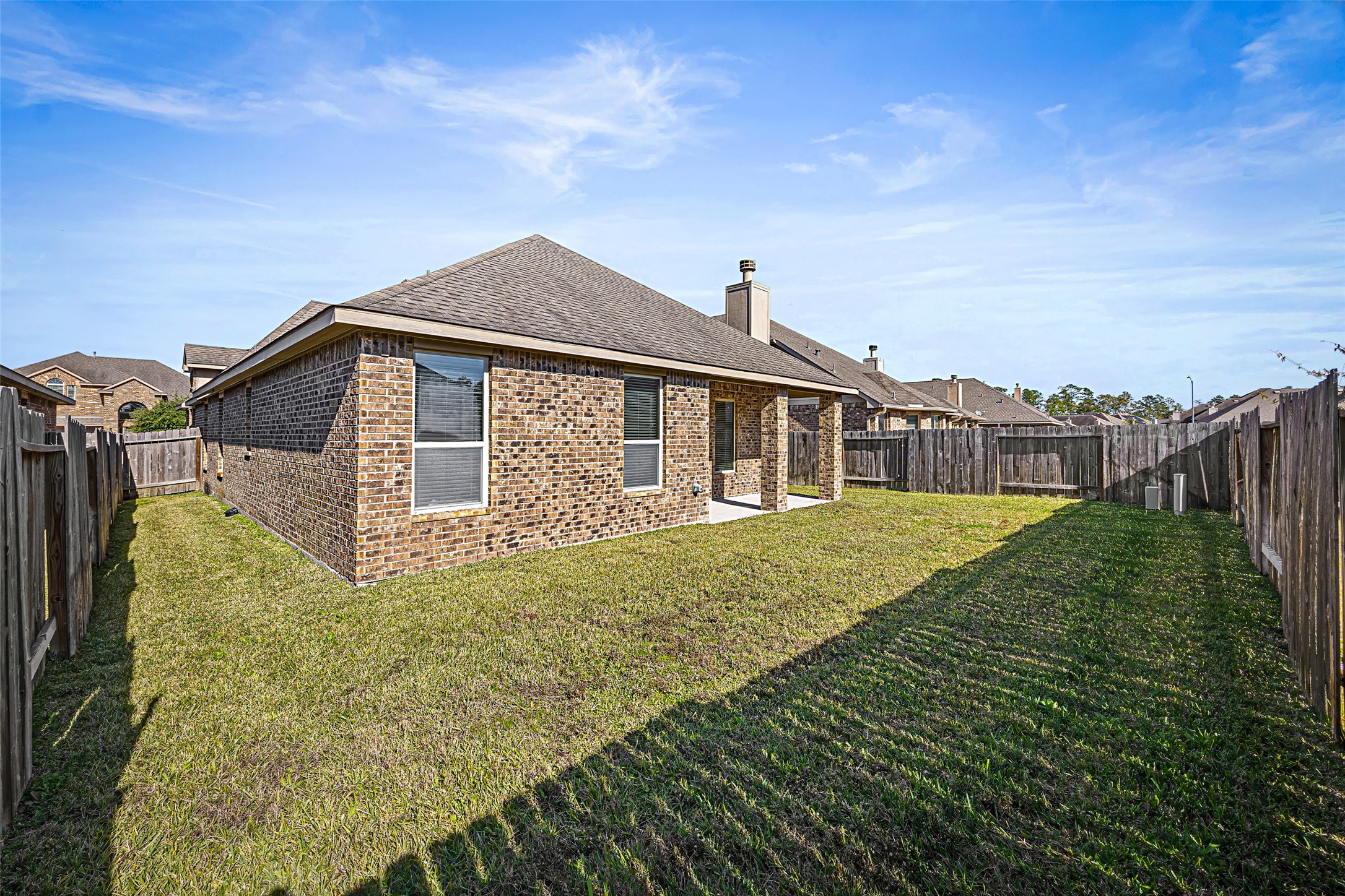 5615 Glenfield Spring Lane Spring, TX 77389 - Photo 26 of 28 a front view of a house with a garden