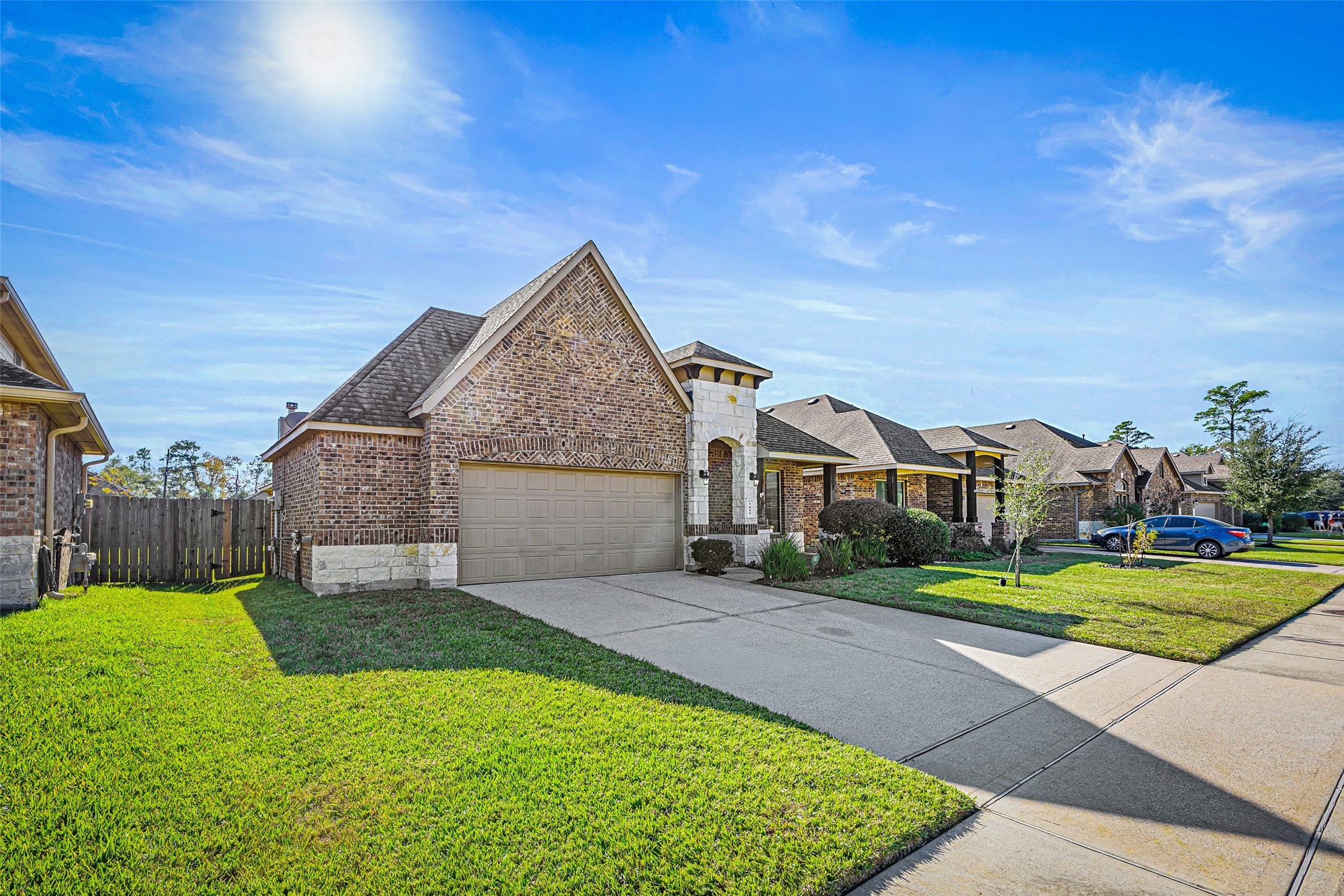 5615 Glenfield Spring Lane Spring, TX 77389 - Photo 3 of 28 a front view of a house with a yard and garage