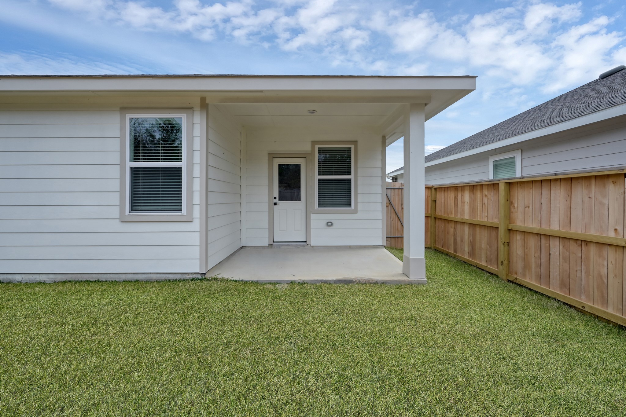 516 Monarch Trail Huntsville, TX 77340 - Photo 18 of 20 a view of a backyard of the house