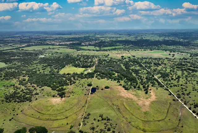 a view of a swimming pool with a yard