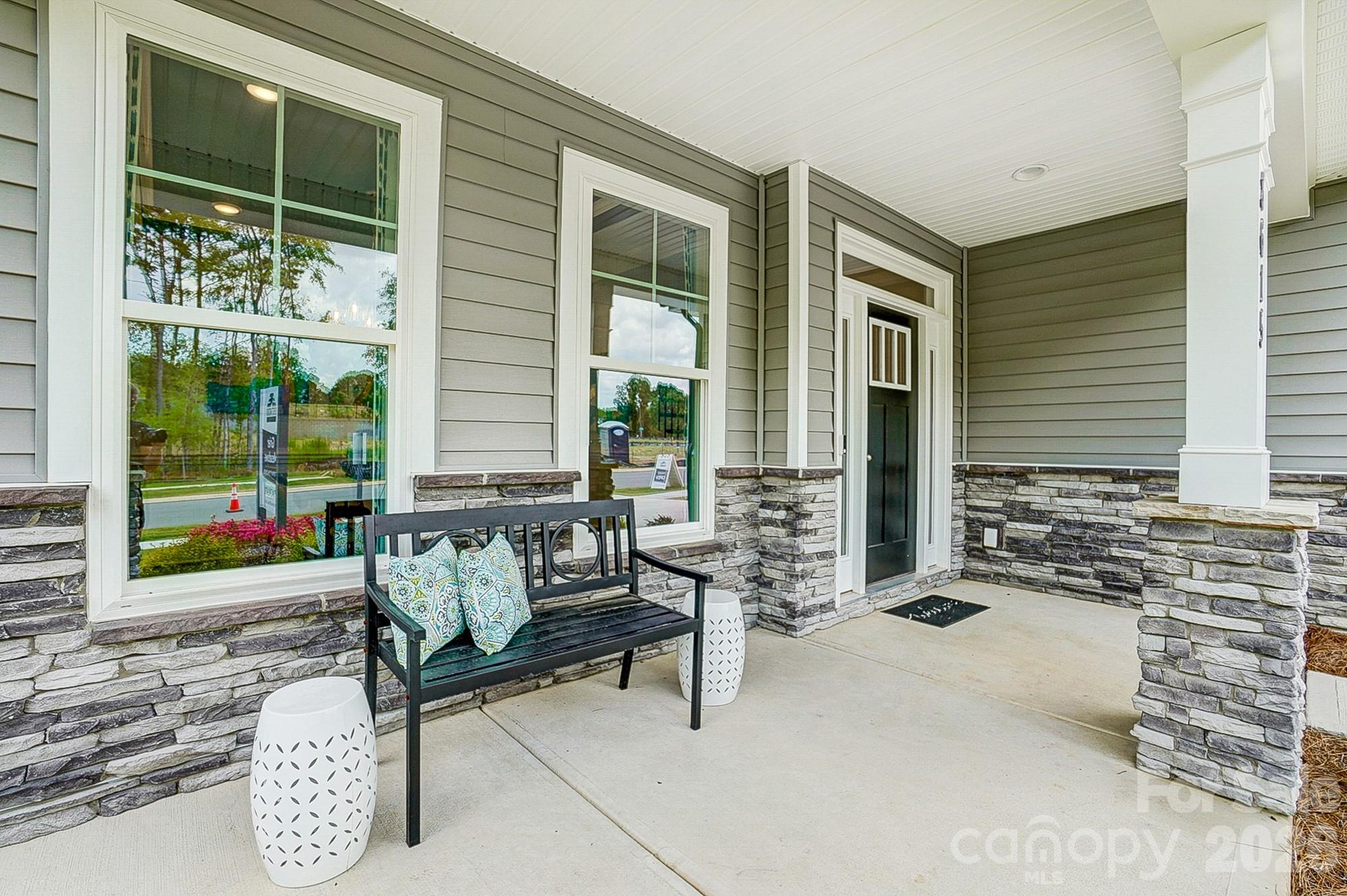 8615 Frank Grier Road Charlotte, NC 28215 - Photo 2 of 47 a building outdoor space with patio furniture and potted plants