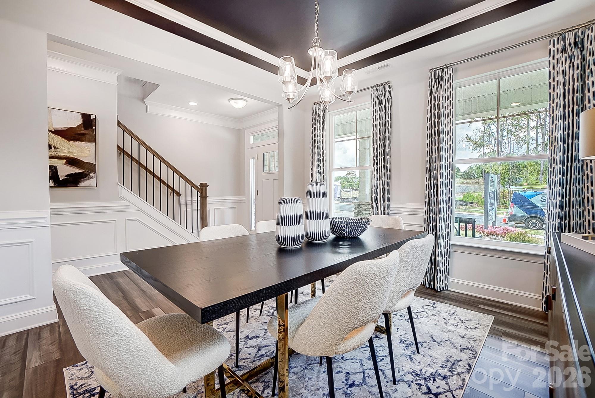 8615 Frank Grier Road Charlotte, NC 28215 - Photo 22 of 47 a view of a dining room with furniture window and wooden floor