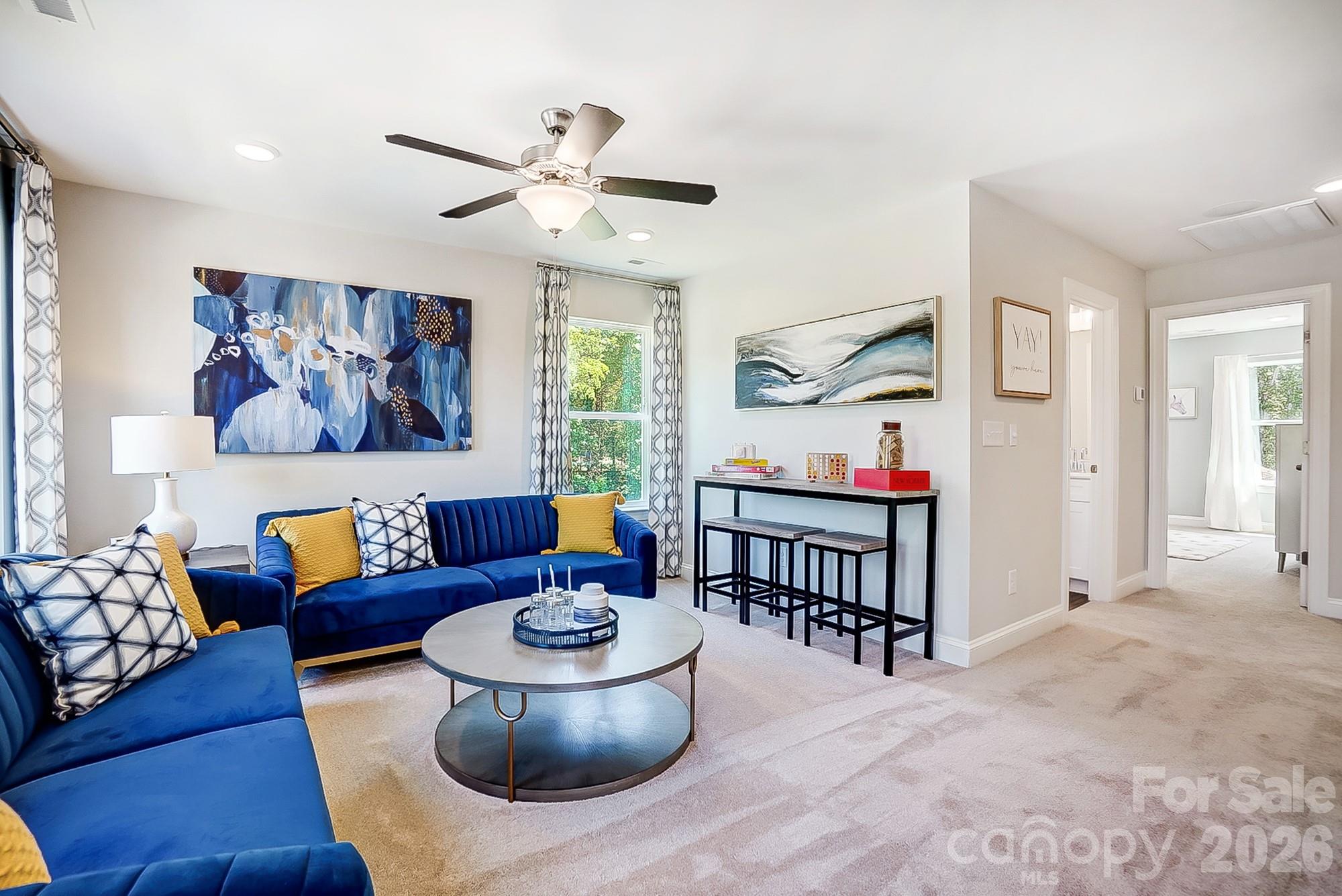 8615 Frank Grier Road Charlotte, NC 28215 - Photo 24 of 47 a living room with furniture and a painting on the wall