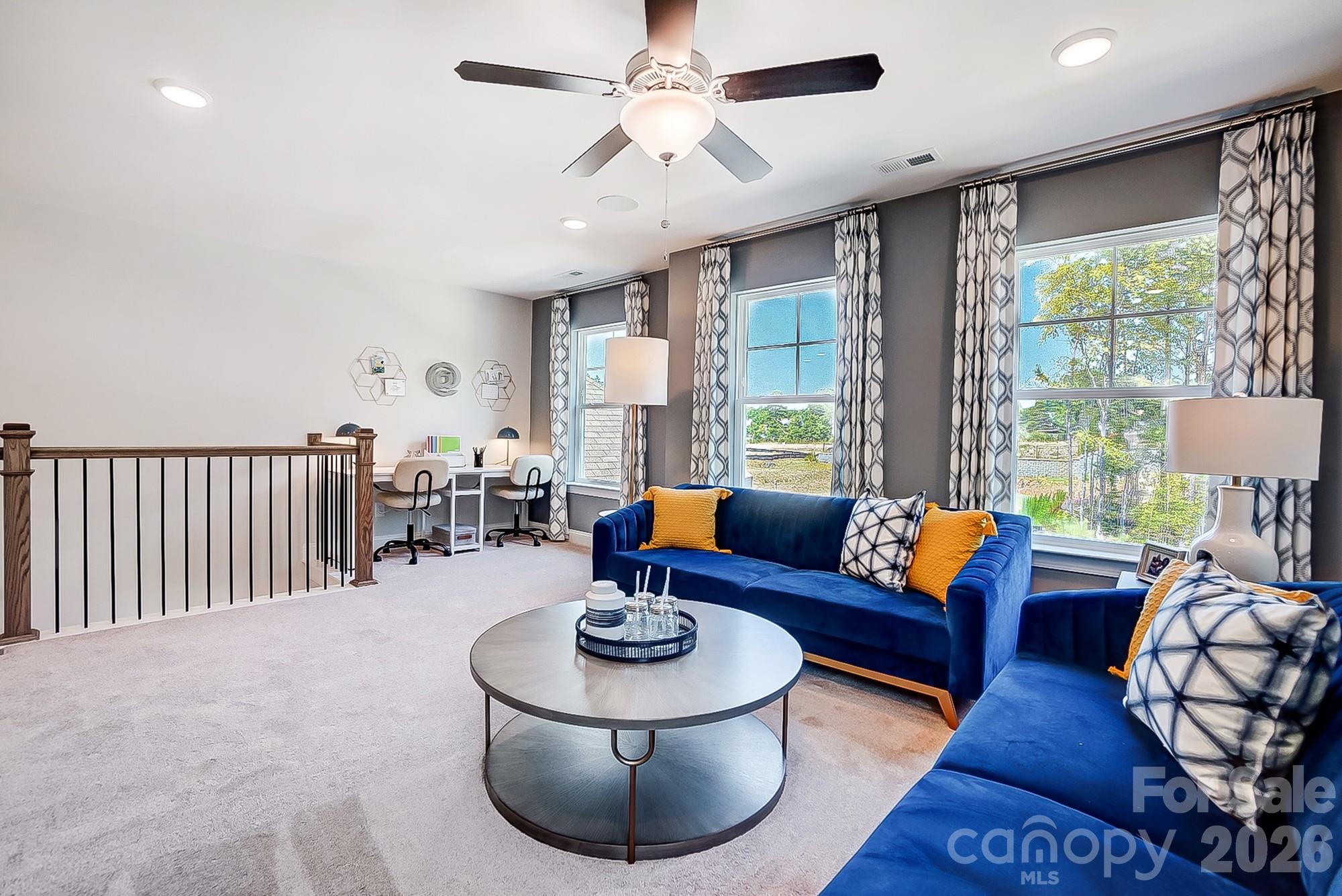 8615 Frank Grier Road Charlotte, NC 28215 - Photo 26 of 47 a living room with furniture and a large window