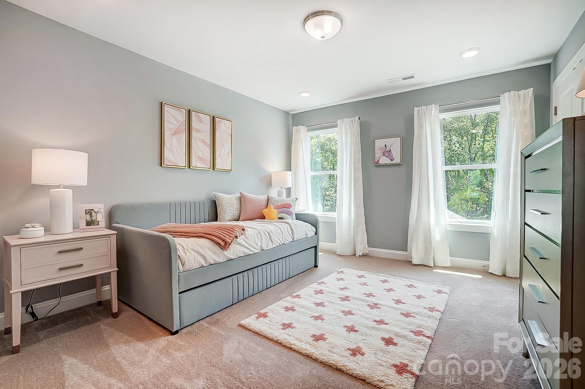 8615 Frank Grier Road Charlotte, NC 28215 - Photo 36 of 47 a bedroom with a bed and a window