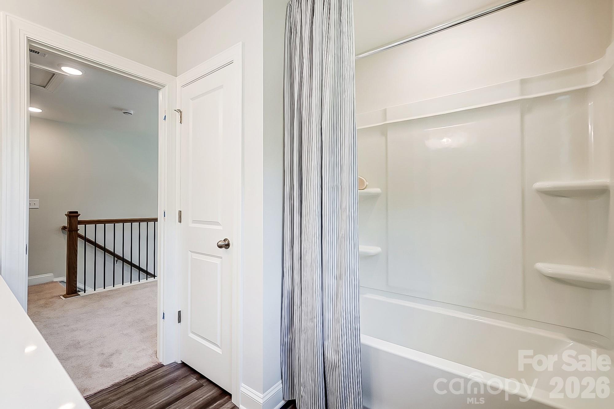 8615 Frank Grier Road Charlotte, NC 28215 - Photo 39 of 47 a bathroom with a bathtub and a shower