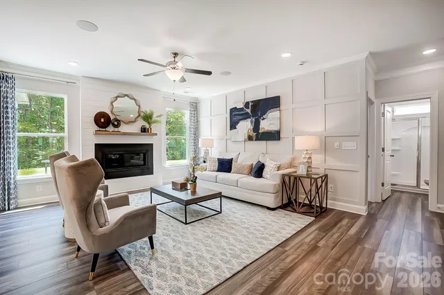 a living room with furniture fireplace and a flat screen tv