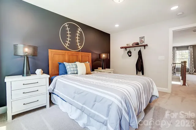 a bedroom with a bed and a lamp