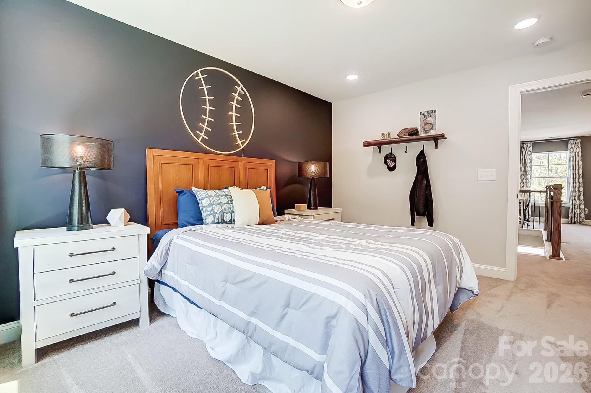 8615 Frank Grier Road Charlotte, NC 28215 - Photo 41 of 47 a bedroom with a bed and a lamp