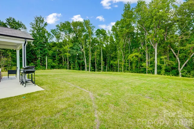 a view of a backyard with a patio