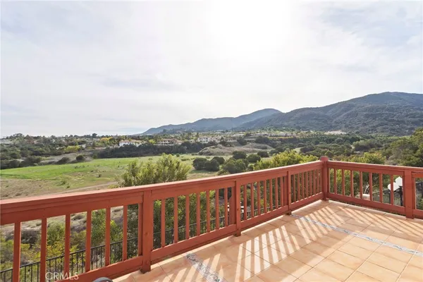 a view of city and mountain from a balcony