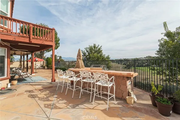 a view of a patio with a table and chairs