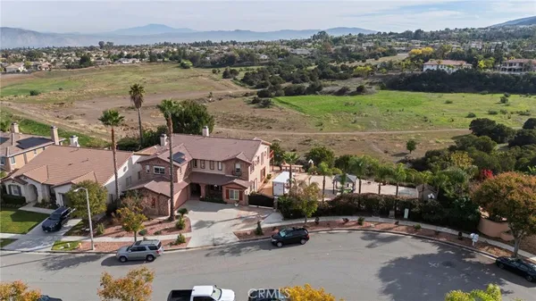 an aerial view of a houses with a yard