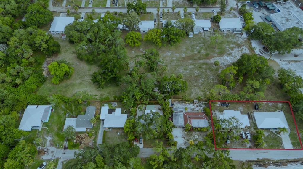 960 46th Street Sarasota, FL 34234 - Photo 14 of 19 an aerial view of a house with a yard and lake view