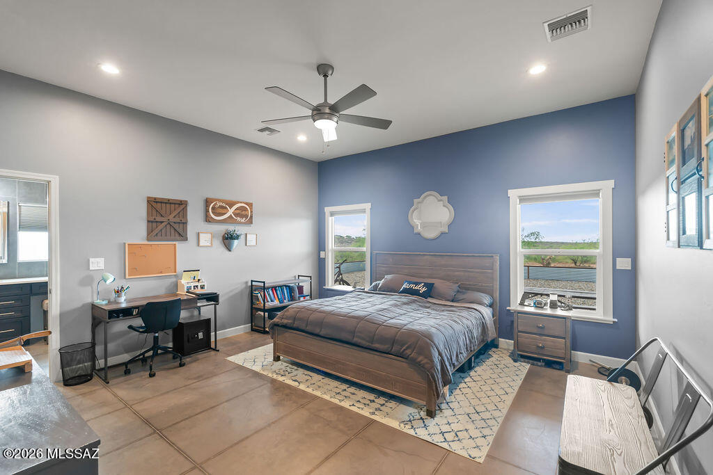 16276 East Empire View Road Vail, AZ 85641 - Photo 34 of 51 a bedroom with a bed gym equipment and a window