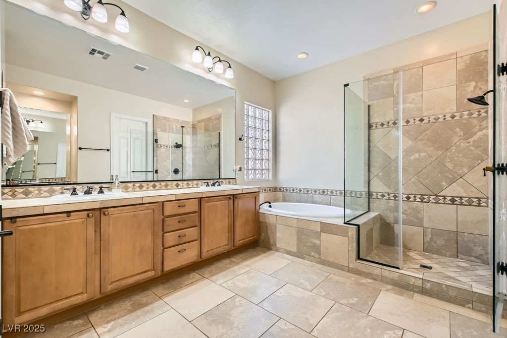 7513 Java Sparrow Street North Las Vegas, NV 89084 - Photo 17 of 36 Bathroom with double vanity, a large walk in showe