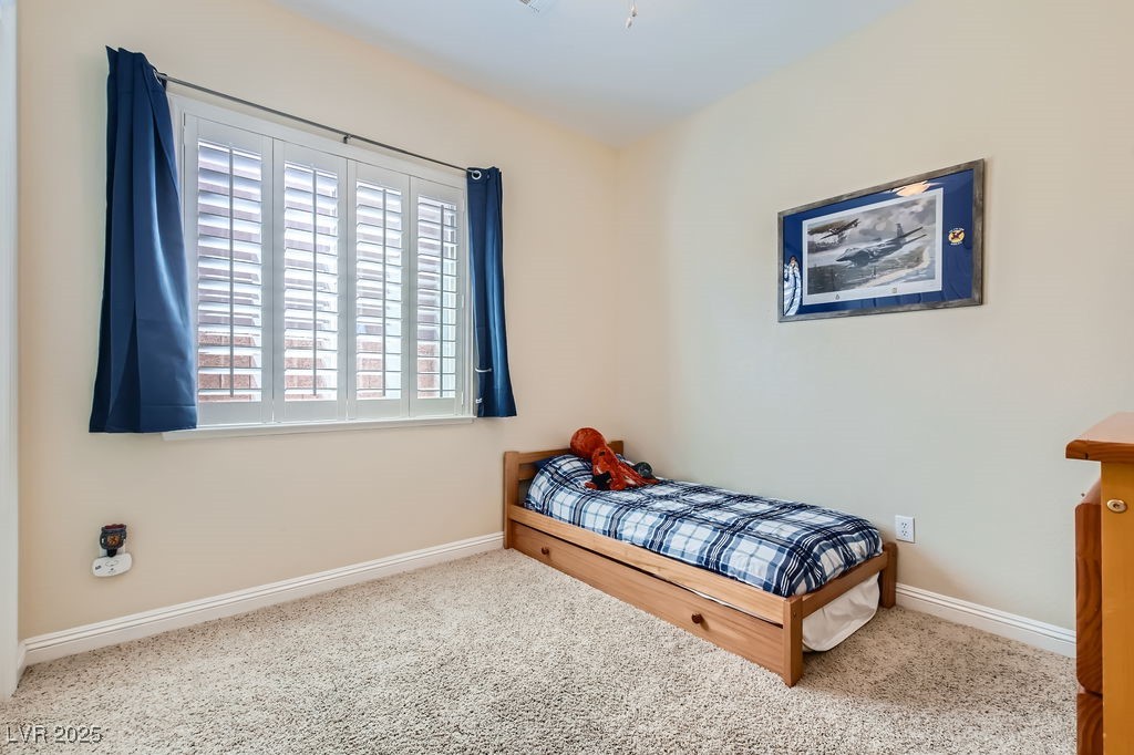 7513 Java Sparrow Street North Las Vegas, NV 89084 - Photo 21 of 36 Bedroom with carpet, ceiling fan with lights