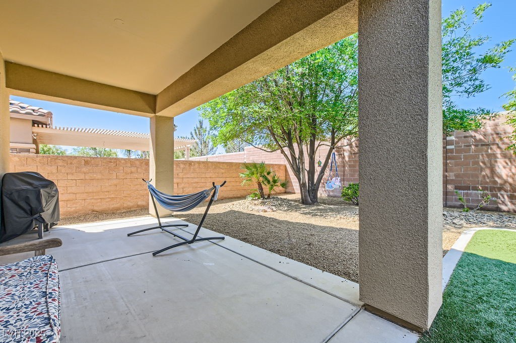 7513 Java Sparrow Street North Las Vegas, NV 89084 - Photo 23 of 36 View of patio / terrace with grilling area and a f