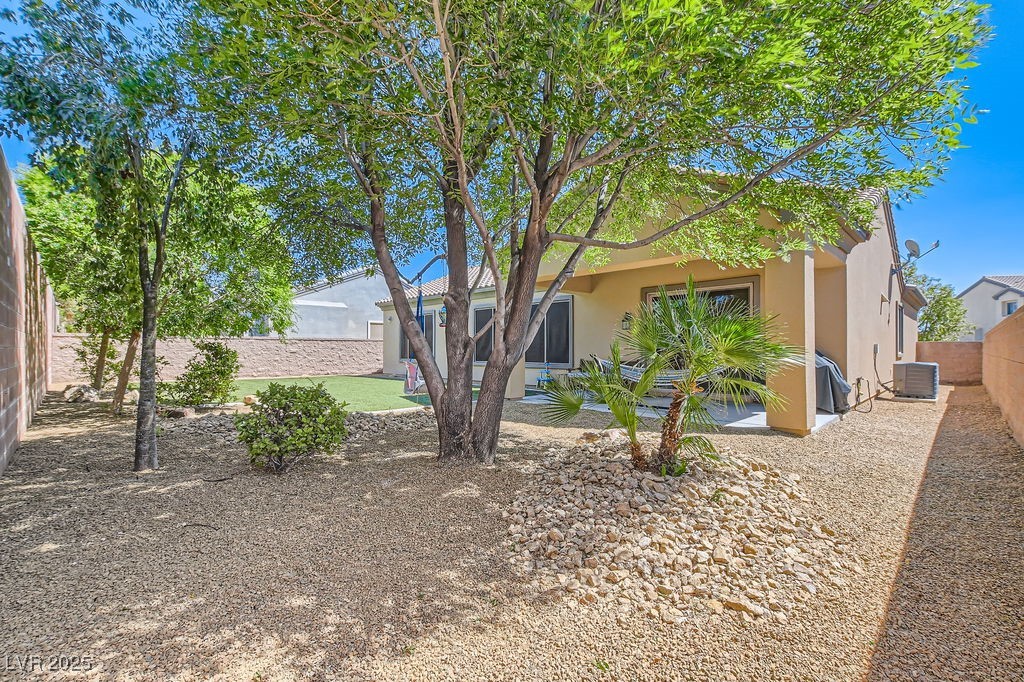 7513 Java Sparrow Street North Las Vegas, NV 89084 - Photo 24 of 36 View of backyard with a patio, a fenced backyard