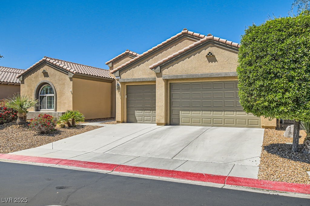 7513 Java Sparrow Street North Las Vegas, NV 89084 - Photo 3 of 36 Mediterranean / spanish-style house featuring an a