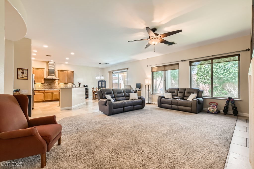 7513 Java Sparrow Street North Las Vegas, NV 89084 - Photo 7 of 36 Living area with ceiling fan with chandelier, ligh